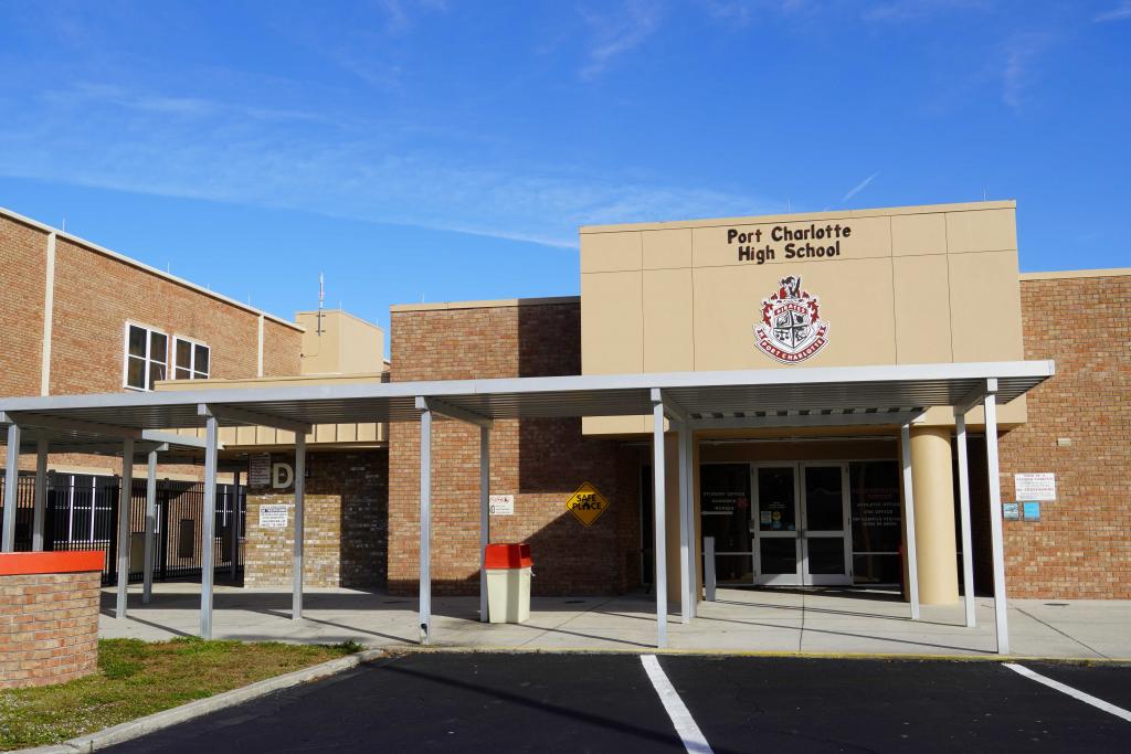 Front entrance of Port Charlotte High School with the Pirates crest above the doors